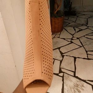 Tan ankle booths. Has never been worn